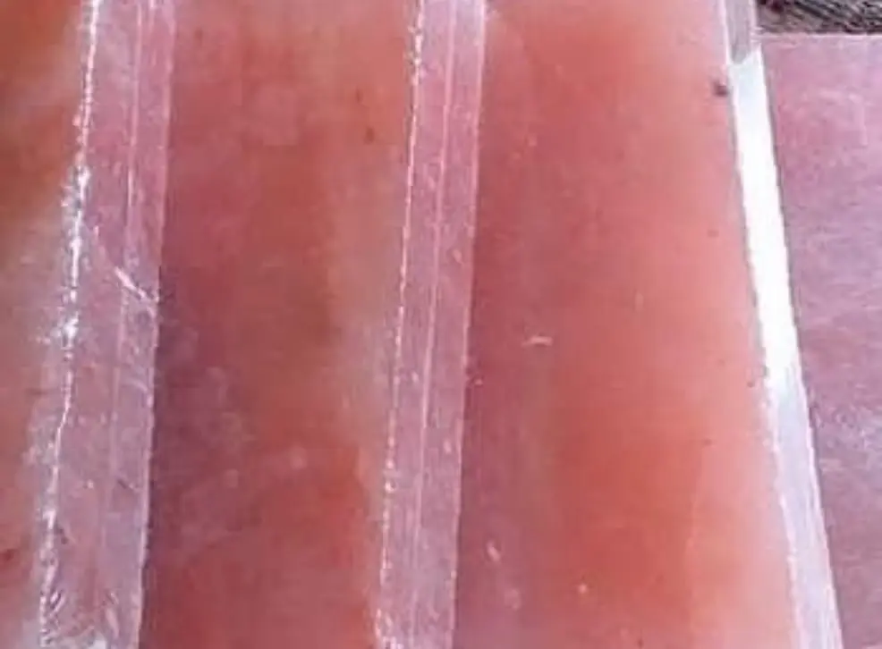 Translucent pink salt slabs standing side by side